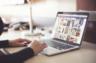 Woman Viewing Images on a Laptop